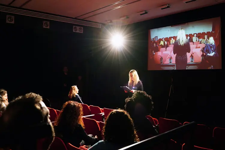 “Dividing the audience into Chinese and Japanese in Glasgow”. Performer, audience, partitions, video camera, projector. Performer: Sacha Carr. 2019. Centre for Contemporary Arts, Glasgow